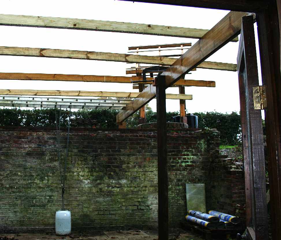 Solar Conservatory timber beams and cross members positioned, but rain halted play.